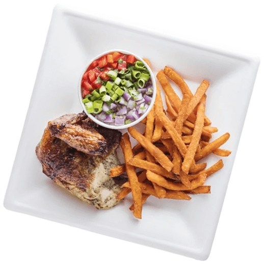 A square white plate with roasted chicken, a serving of French fries, and a small bowl of diced tomatoes, onions, and green onions.